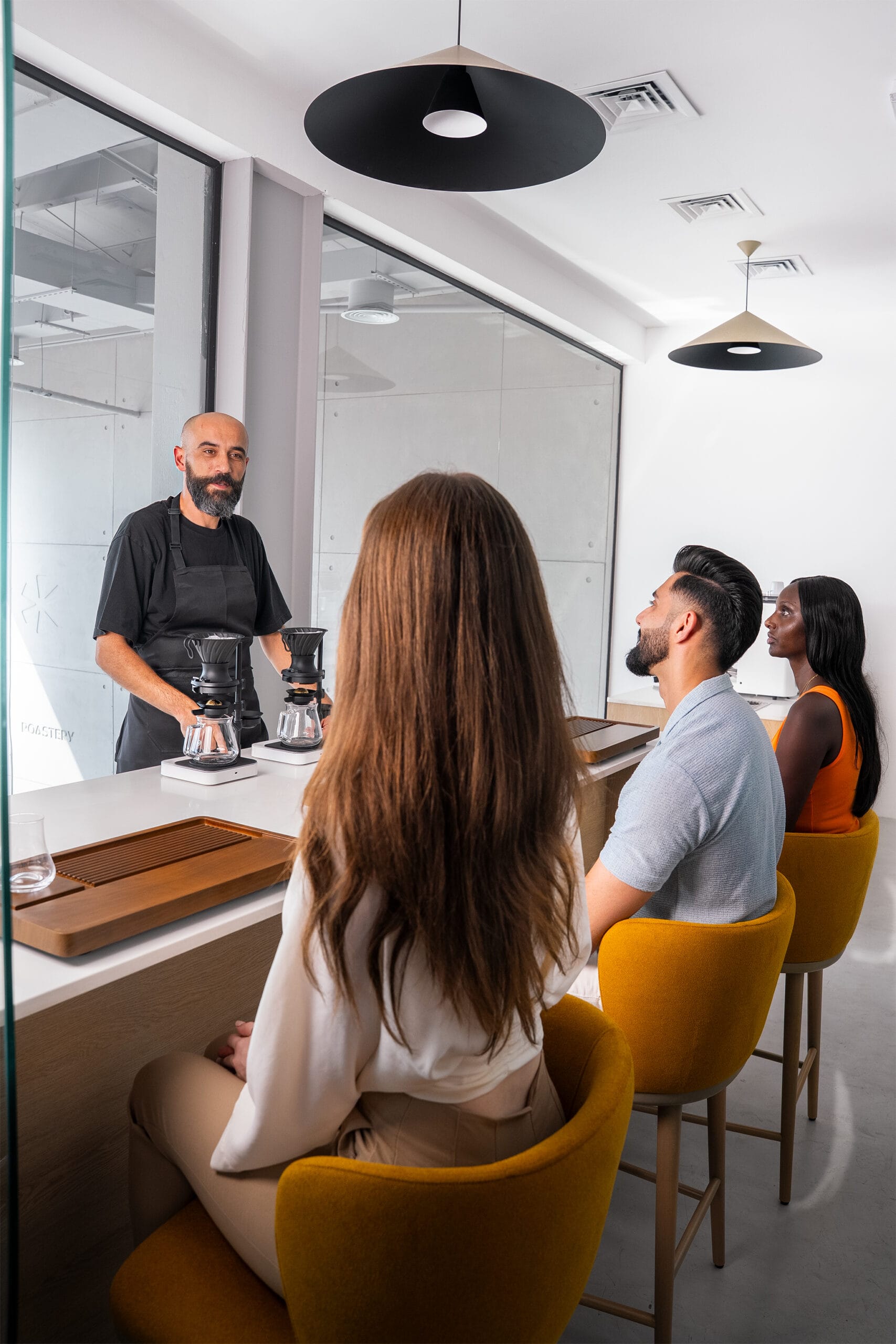 Julith's Barista Serkan Sağsöz Coffee tasting session with participants.