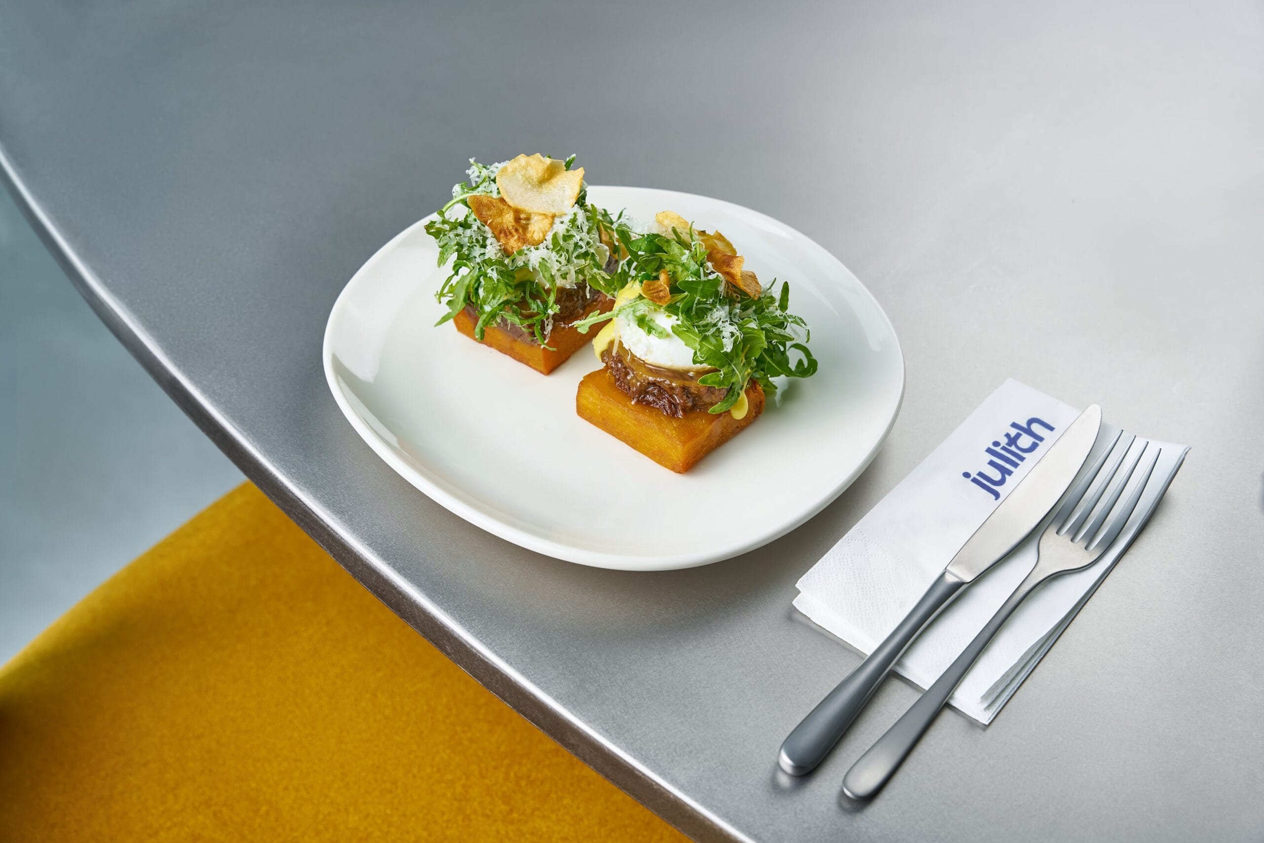 Gourmet dish with greens and toppings