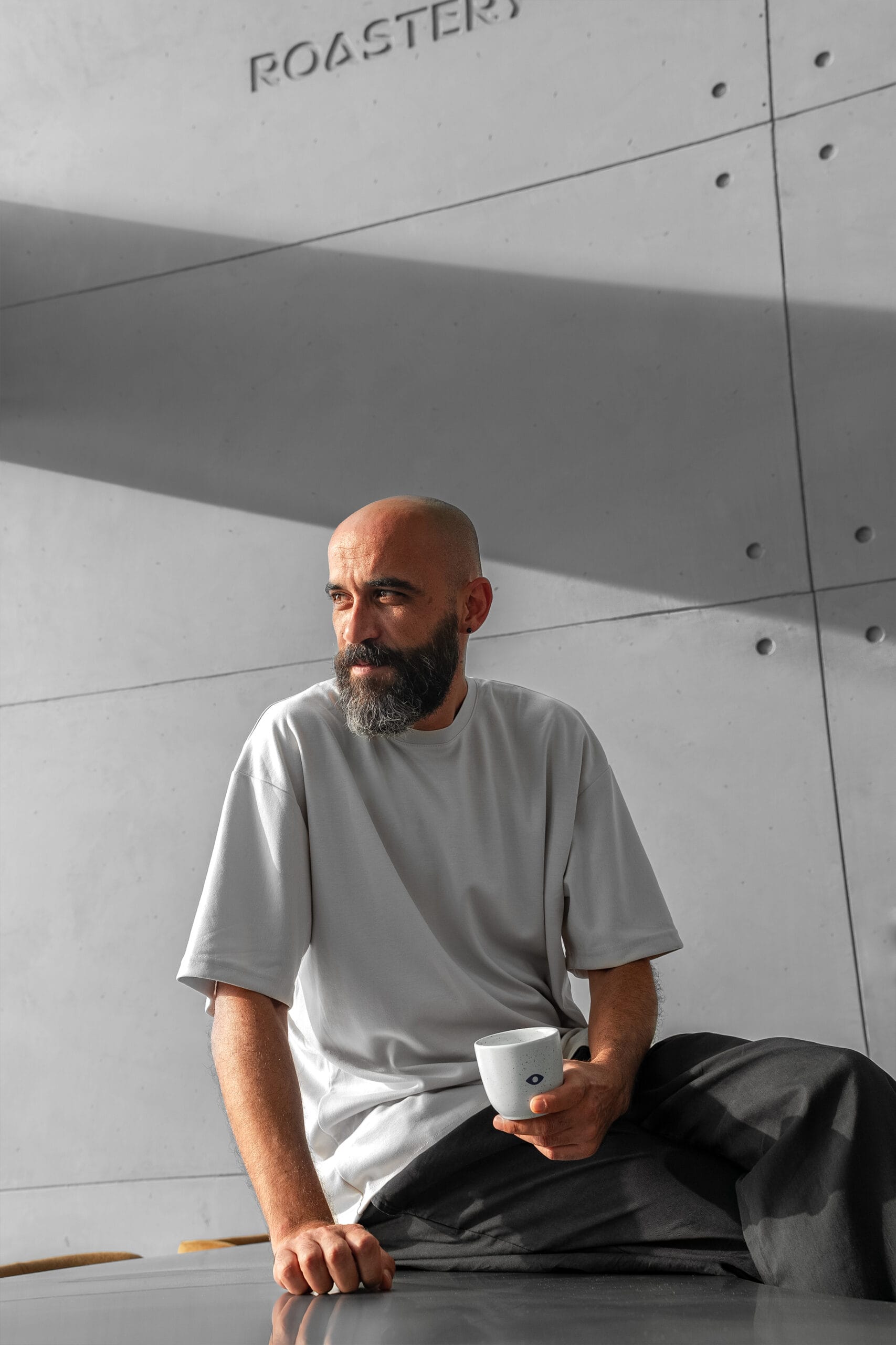 Barista Serkan Sağsöz with a cup of coffee